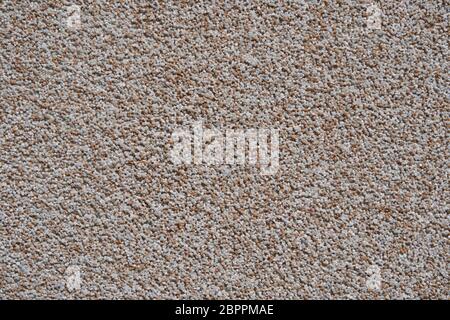 close view of the wall surface, decorative finishing, heat insulation granules or granite particles Stock Photo