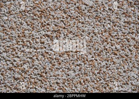 close view of the wall surface, decorative finishing, heat insulation granules or granite particles Stock Photo