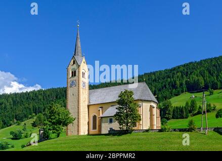 village church on a hill at Kartitsch in the Lesach valley of Eastern Tirol in sunshine, Austria Stock Photo