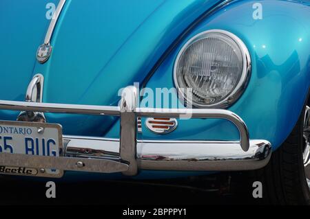 TORONTO, CANADA - 08 18 2018: Front part of exterior with wheel, fender, bumper, hood, front light of blue 1955 Volkswagen Beetle oldtimer car on Stock Photo