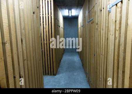 Inside of a bunker with a wooden interior and and with several corridors to protect from a bomb attack Stock Photo