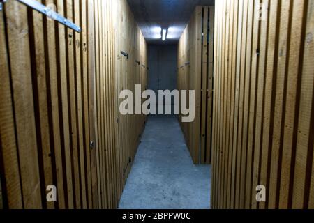 Inside of a bunker with a wooden interior and and with several corridors to protect from a bomb attack Stock Photo