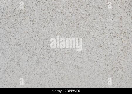 Rough bumpy white concrete plaster texture background. Stock Photo