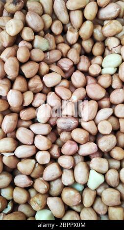 Close up of peeled peanut on well peanuts Stock Photo