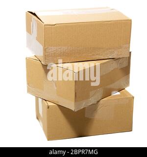 Three closed cardboard boxes packed with goods ready for shipping Stock Photo