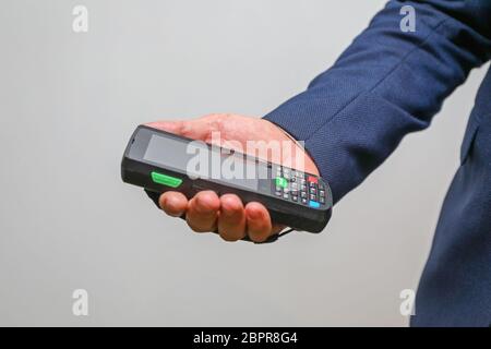 Man Holding Handheld Barcode Reader Scanner Mobile Computer Stock Photo