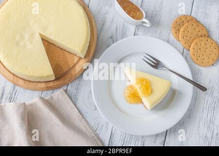 Traditional cheesecake on the wooden table flat lay Stock Photo