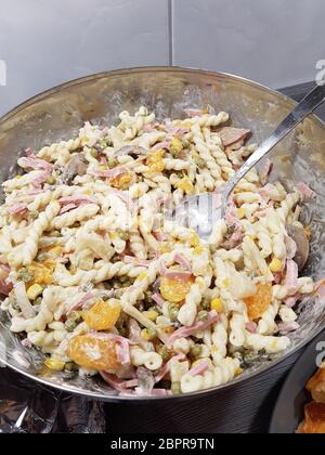 Homemade pasta salad with freshly chopped basil and tomatoes Stock Photo