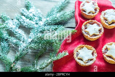 Decorated Christmas tree branch with holiday pastry Stock Photo