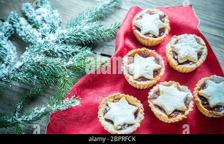 Decorated Christmas tree branch with holiday pastry Stock Photo