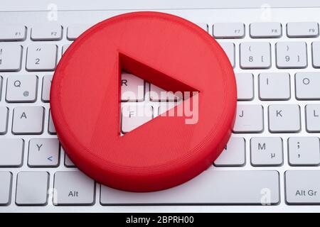 An Elevated View Of Red Play Button On White Keyboard Stock Photo