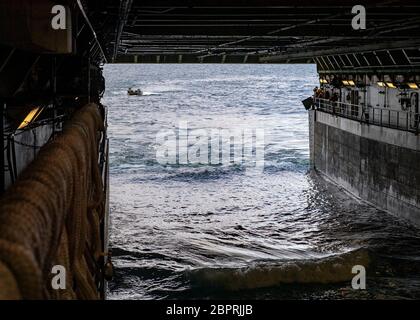 PACIFIC OCEAN (April 8, 2020) U.S. Marines assigned to 3rd Assault Amphibian Battalion (3d AA BN) approach the well deck of the San Antonio-class amphibious transport dock ship USS San Diego (LPD 22) in an amphibious assault vehicle (AAV) during an underway AAV onload exercise.  USS San Diego is conducting routine operations in the Third Fleet area of operations. (U.S. Navy photo by Mass Communication Specialist 1st Class Benjamin K. Kittleson) Stock Photo