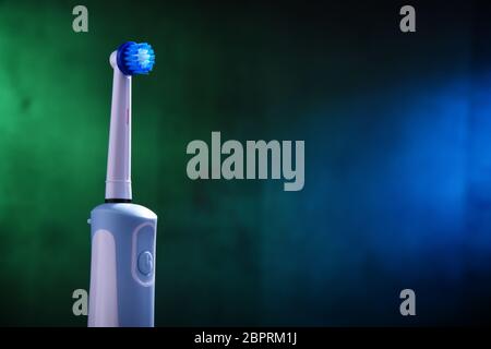 Modern electric toothbrush powered by rechargeable battery. Stock Photo