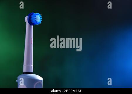 Modern electric toothbrush powered by rechargeable battery. Stock Photo