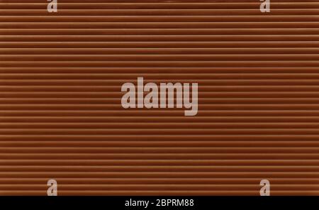 Background texture of dark brown color painted horizontal metal window roller shutter blinds Stock Photo
