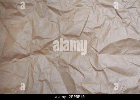 Craft crumpled beige paper for background usage. Eco Zero Waste background. Copy space. Stock Photo