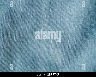 Modern soft jeans blouse texture close up. Lyocell or tencel pattern - modern natural cellulose fabric blue denim color. Can use for design or text. C Stock Photo