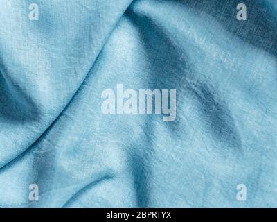 Modern soft jeans blouse texture close up. Lyocell or tencel pattern - modern natural cellulose fabric blue denim color. Can use for design or text. C Stock Photo