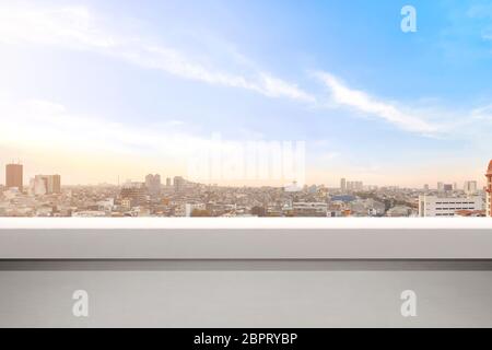 Empty balcony with modern cityscapes and blue sky background. Jakarta, Indonesia. Stock Photo