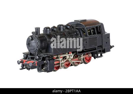 Locomotive isolated. Vintage model of an electric toy steam train isolated on a white background. Decorations background. Stock Photo