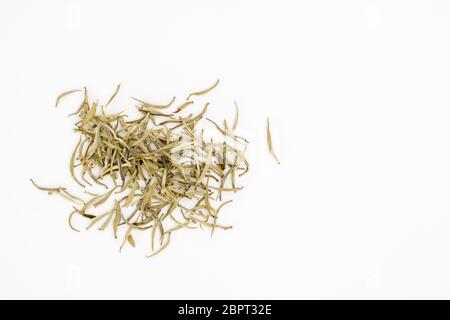 Silver needles white tea leaves or Baihao Yinzhen (Camelia sinensis) on a white background Stock Photo