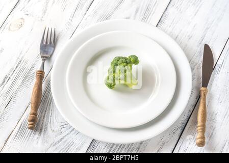 Fresh broccoli on the white plate Stock Photo
