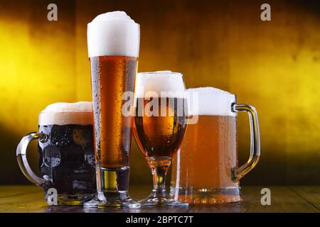 Composition with four glasses of beer. Stock Photo