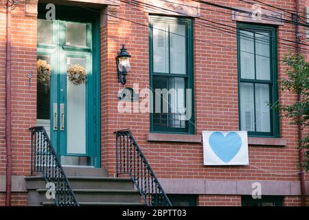 Hoboken, NJ, USA - May 13th 2020 : Sign on a residential building expressing gratitude to front liners, first responders and health care workers and Stock Photo
