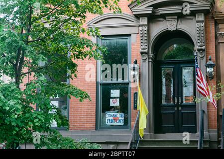 Hoboken, NJ, USA - May 13th 2020 : Sign on a residential building expressing gratitude to front liners, first responders and health care workers and Stock Photo