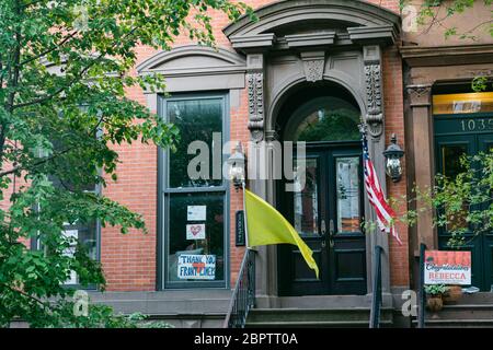 Hoboken, NJ, USA - May 13th 2020 : Sign on a residential building expressing gratitude to front liners, first responders and health care workers and Stock Photo