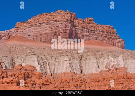 Sandstone Cliffs Against a Blue Sky in Goblin Valley State Park in Utah Stock Photo