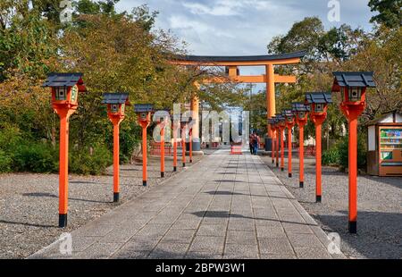 KYOTO, JAPAN - OCTOBER 17, 2019: The front way (sando) to the Hirano Shrine decorated along its course with the red lanterns.  Kyoto. Japan Stock Photo