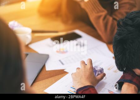 Three businessman get stressed while having a problem in business meeting Stock Photo