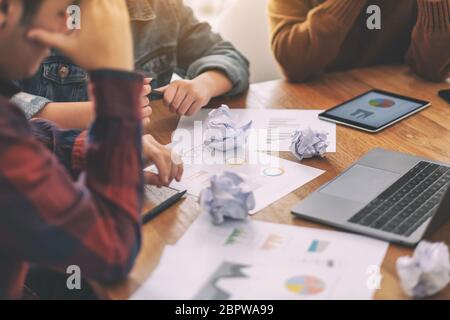 Three businessman get stressed while having a problem in business meeting Stock Photo