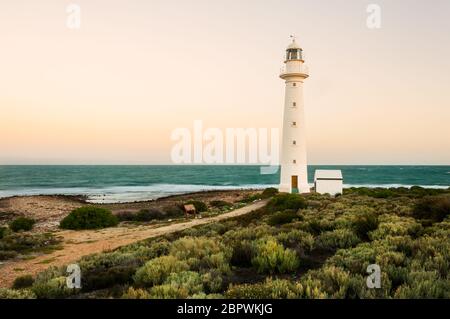 Point Lowly Lighthouse at dawn in a hue of orange and pink. Stock Photo