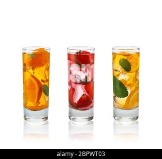Fresh natural fruit  cocktails with straw on white background. Stock Photo