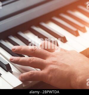 Man playing piano Stock Photo