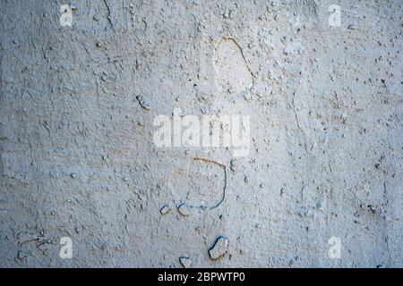 wall with dry and cracked blue paint Stock Photo