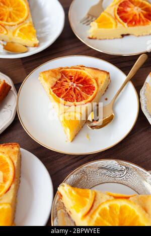 Fruity sponge cake with fresh candied oranges Stock Photo