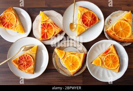 Fruity sponge cake with fresh candied oranges Stock Photo