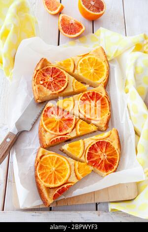 Fruity sponge cake with fresh candied oranges Stock Photo