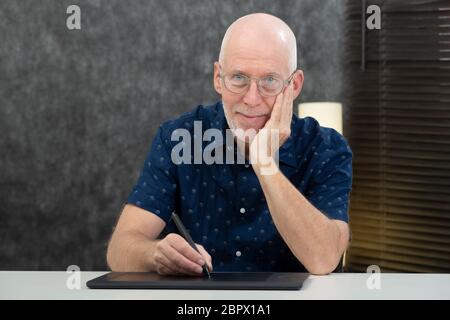 a senior designer using graphic tablet at office Stock Photo