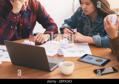 Three businessman get stressed while having a problem in business meeting Stock Photo