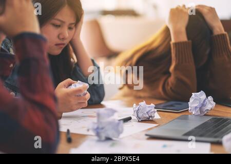 Three businessman get stressed while having a problem in business meeting Stock Photo