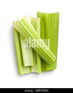 Celery sticks. Cutting celery stalks isolated on white background. Stock Photo