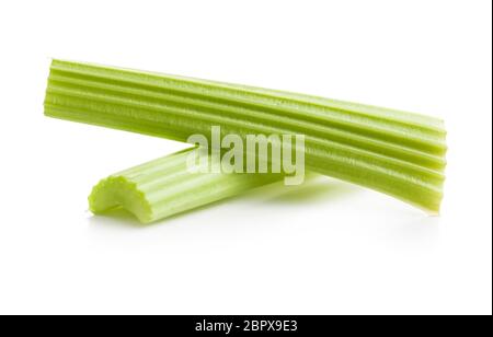 Celery sticks. Cutting celery stalks isolated on white background. Stock Photo
