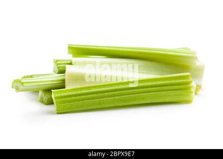 Celery sticks. Cutting celery stalks isolated on white background. Stock Photo