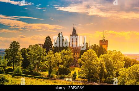 Beautiful sunset landscape with Schloss Drachenburg Castle in Konigswinter on the Rhine river near the city of Bonn in Germany Stock Photo