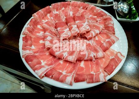 Hotpot beef rolls closeup on plate. Traditional chinese food Stock Photo