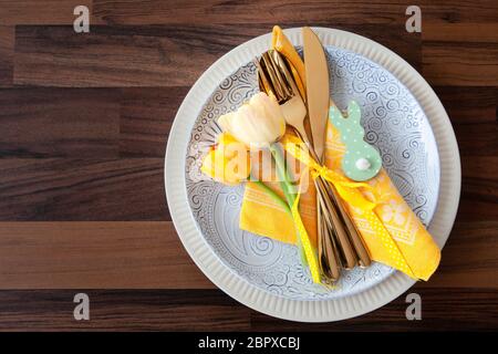 Festive table setting with fresh tulips for easter Stock Photo
